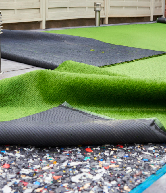 installing artificial grass in garden of home